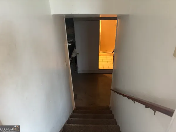 a view of a hallway with a window