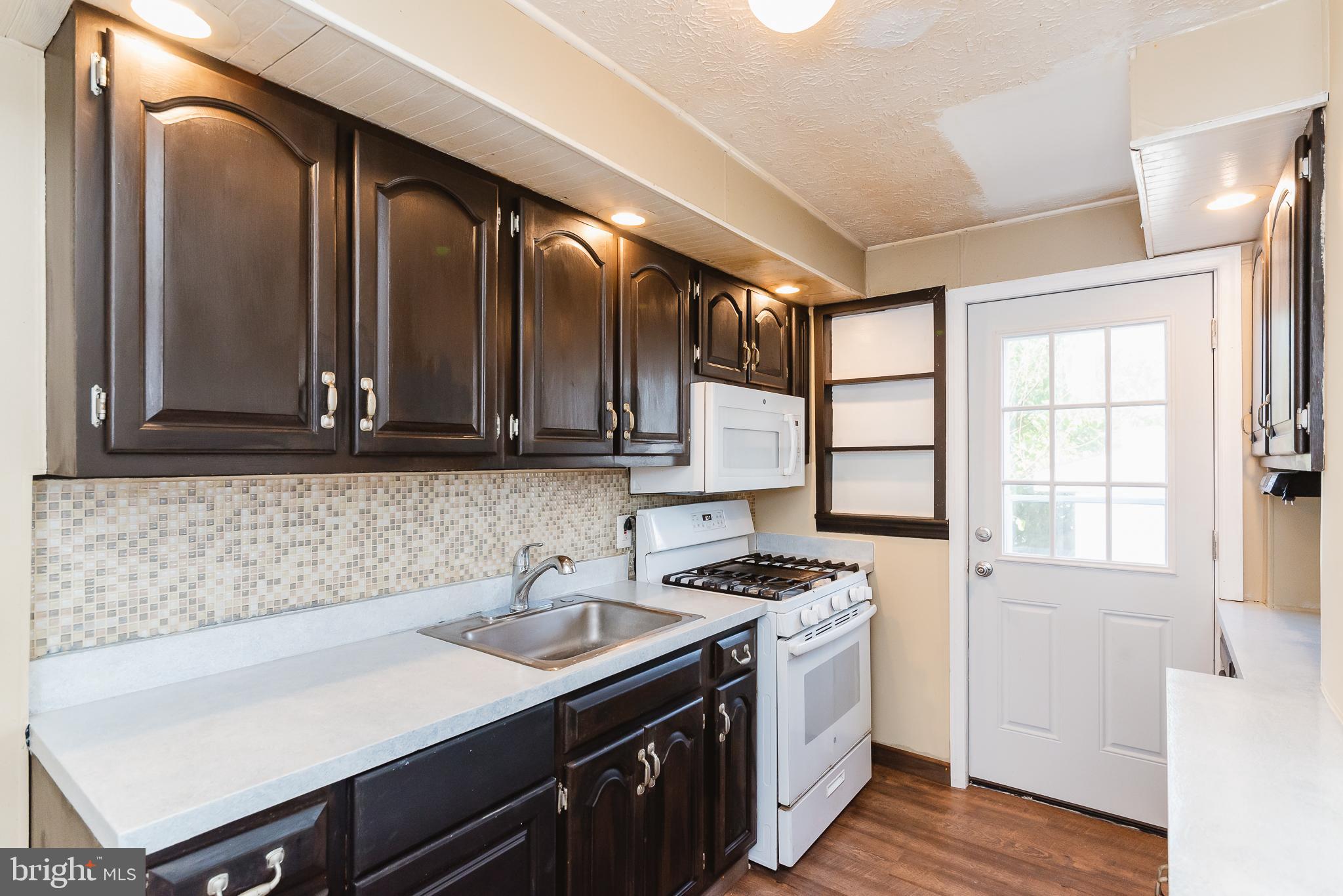 7446 Berkshire Road Baltimore, MD 21224 - Photo 18 of 47 Kitchen with updated countertops