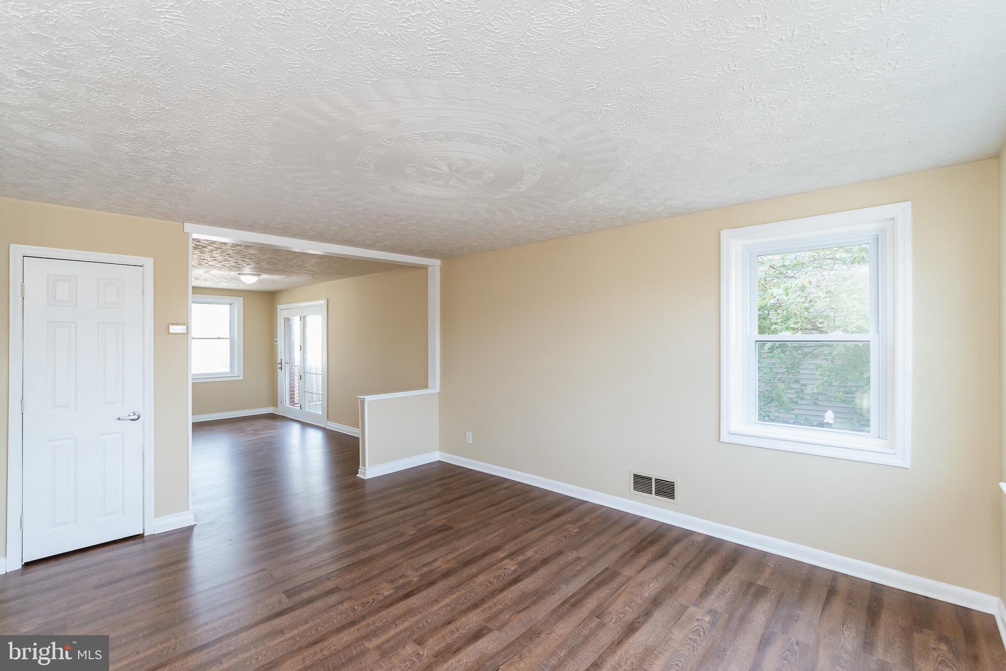 7446 Berkshire Road Baltimore, MD 21224 - Photo 9 of 47 Living Room View into Dining Room