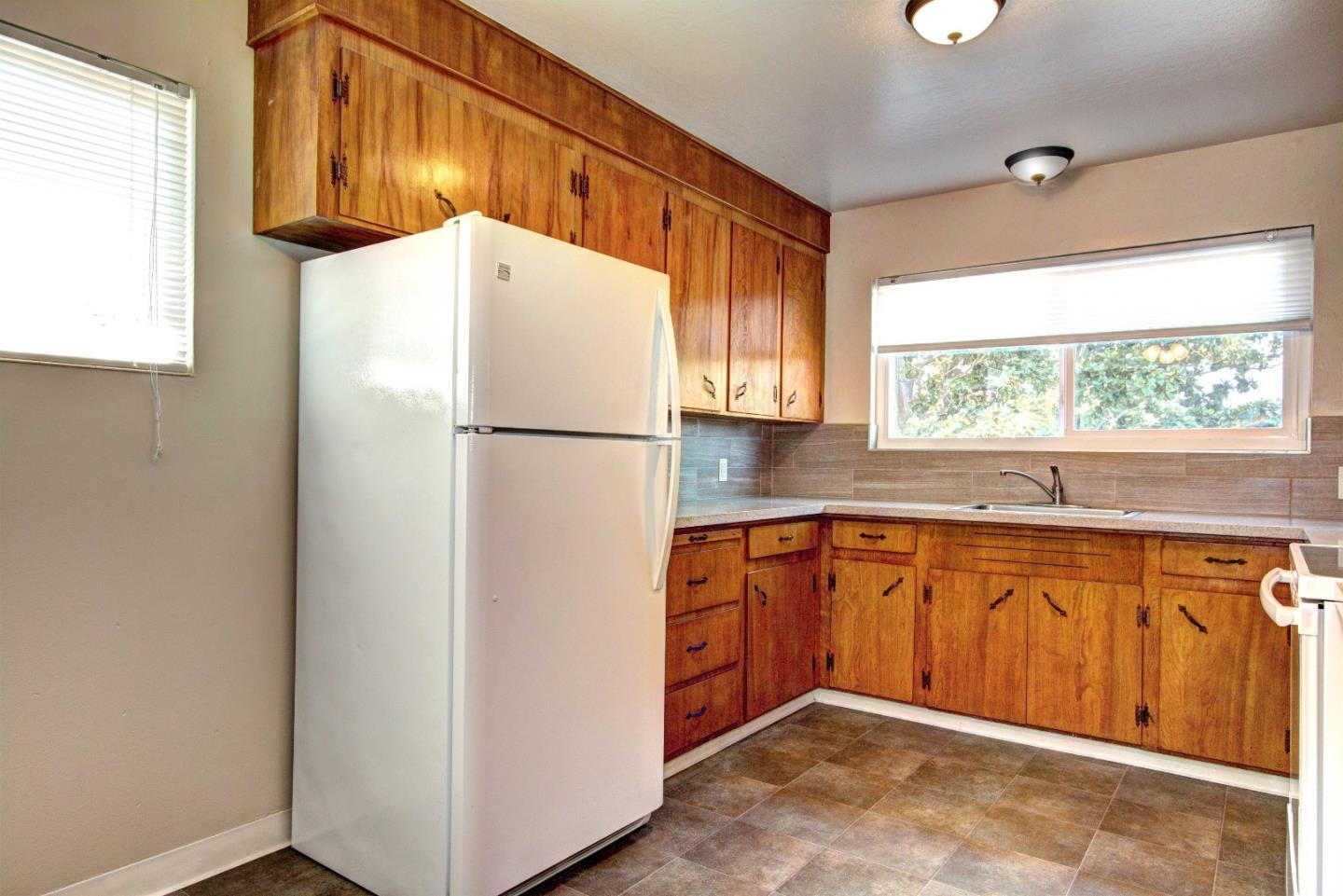1005 Williams Way Mountain View, CA 94040 - Photo 2 of 8 a kitchen with sink a refrigerator and a window