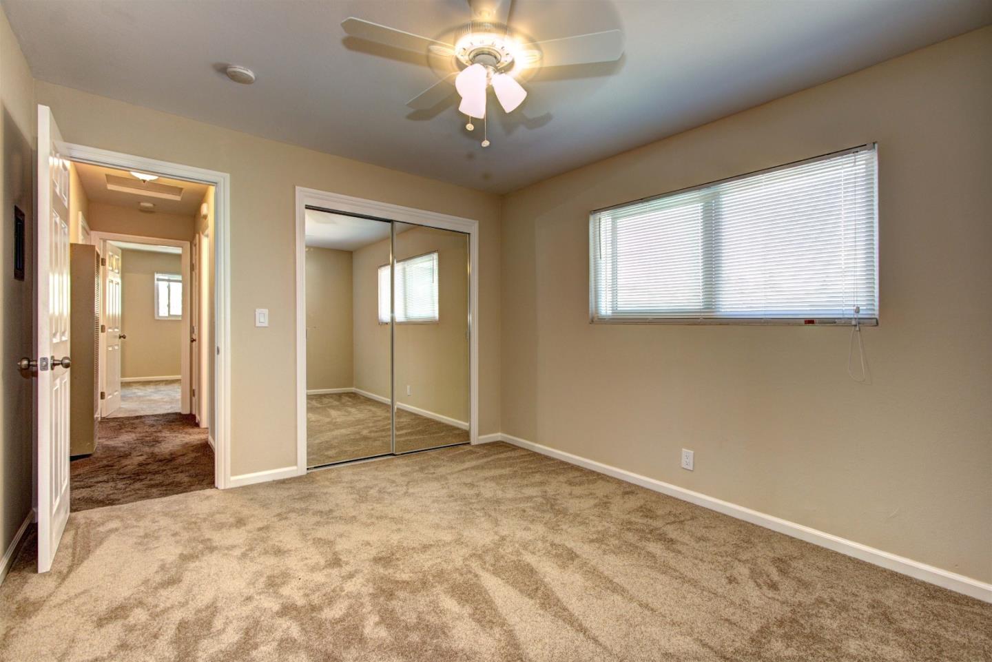 1005 Williams Way Mountain View, CA 94040 - Photo 6 of 8 a view of a livingroom with a chandelier fan and windows
