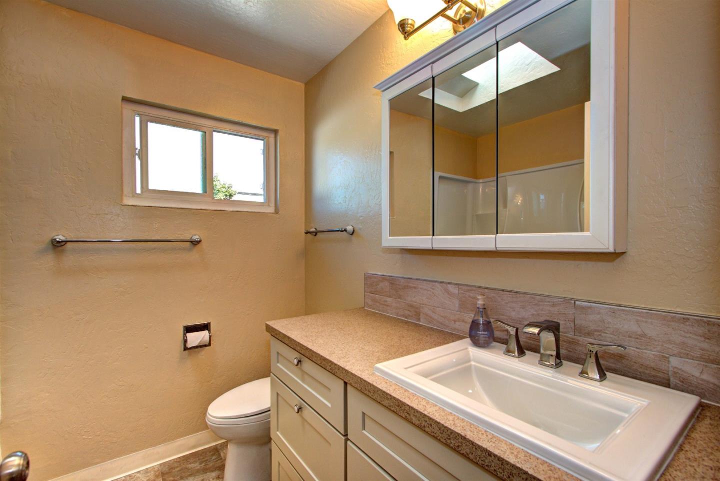 1005 Williams Way Mountain View, CA 94040 - Photo 7 of 8 a bathroom with a sink toilet vanity and mirror