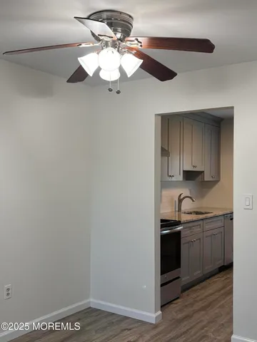 a view of a kitchen with a sink and cabinets