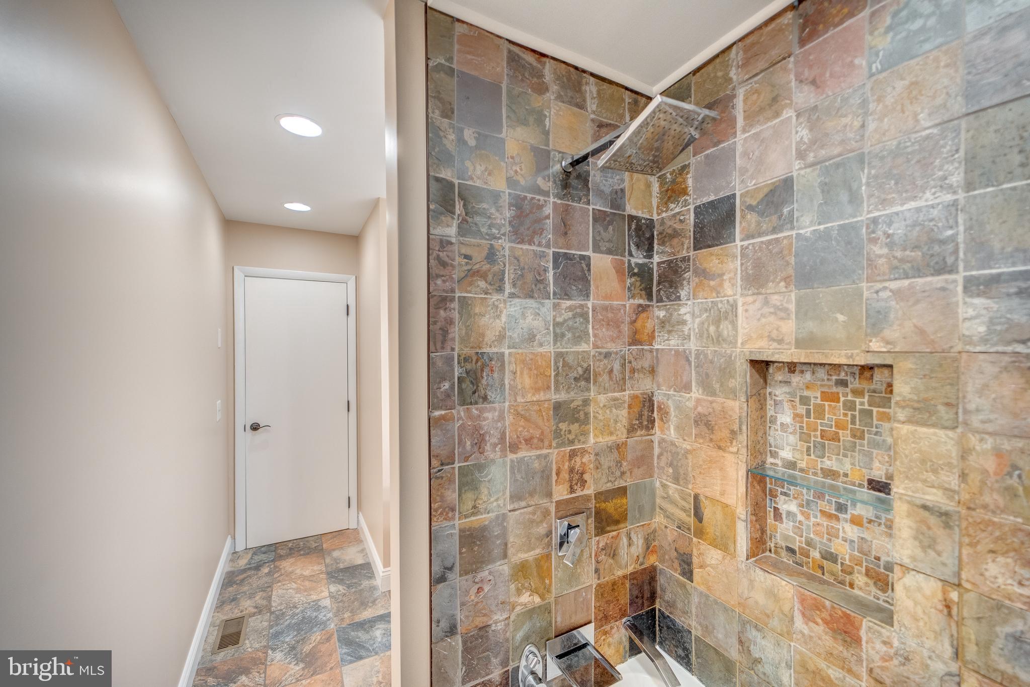 205 Newtown Road Chester, MD 21619 - Photo 50 of 53 Primary Bathroom, tile flooring, tile surround