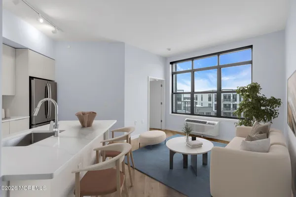 a living room with furniture and a large window