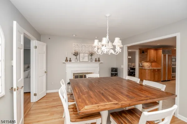 a kitchen with stainless steel appliances a stove and more cabinets