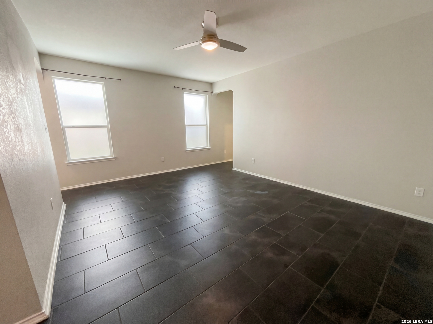 11403 Sawyer Road San Antonio, TX 78238 - Photo 11 of 20 an empty room with windows and fan