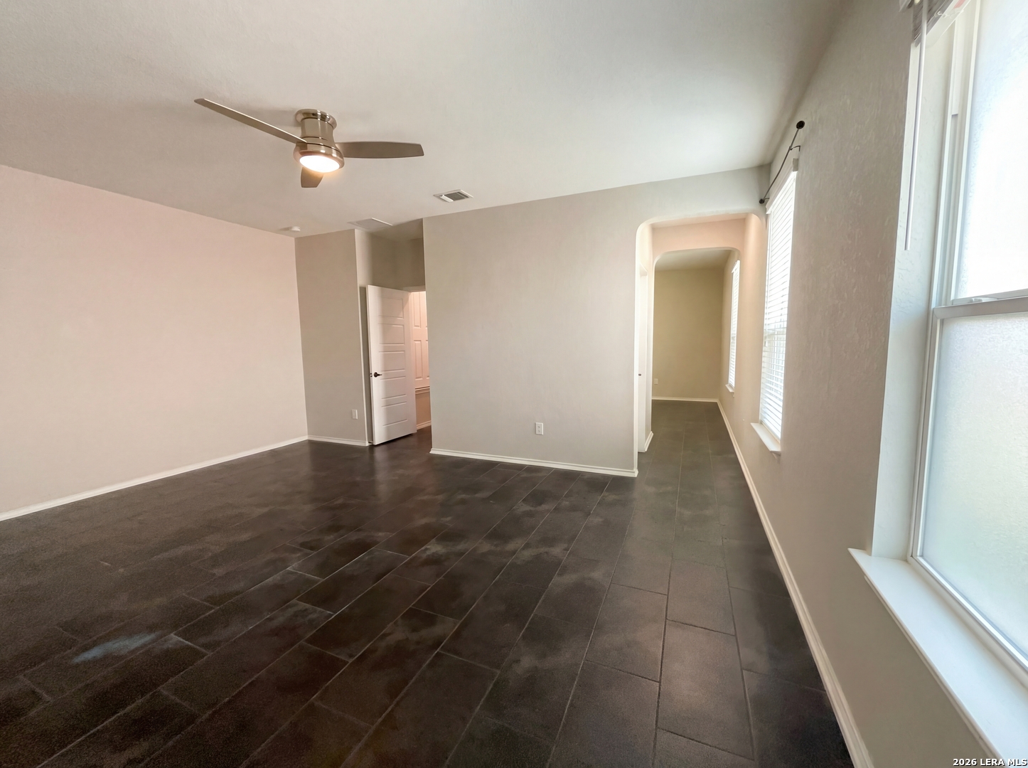 11403 Sawyer Road San Antonio, TX 78238 - Photo 13 of 20 an empty room with wooden floor and windows