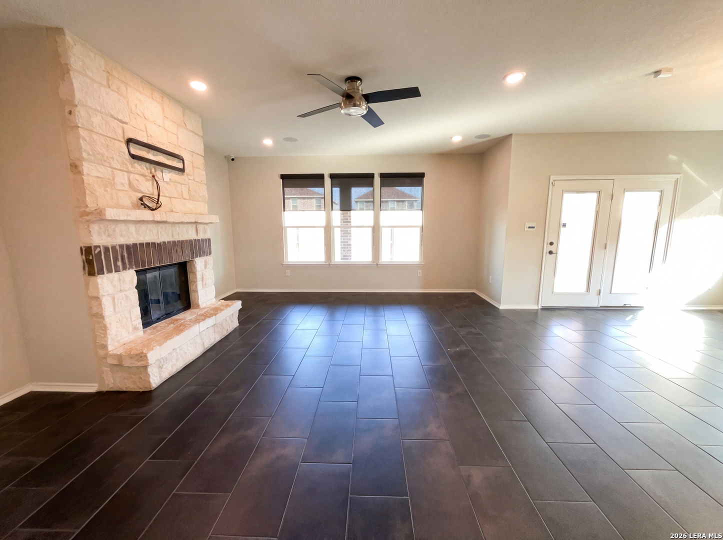 11403 Sawyer Road San Antonio, TX 78238 - Photo 15 of 20 a view of an empty room with wooden floor and a window