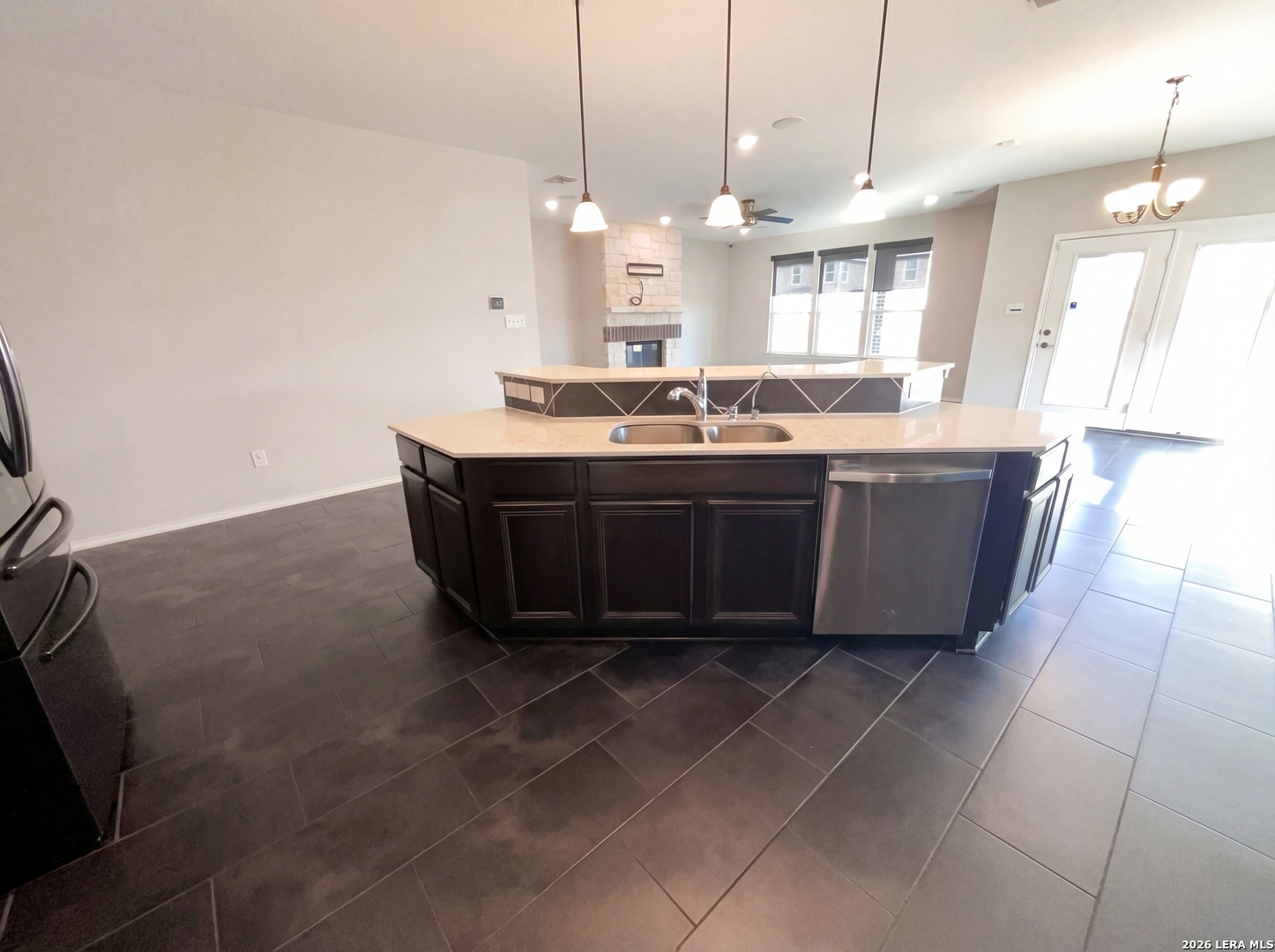 11403 Sawyer Road San Antonio, TX 78238 - Photo 18 of 20 a large kitchen with kitchen island a sink stainless steel appliances and a chandelier