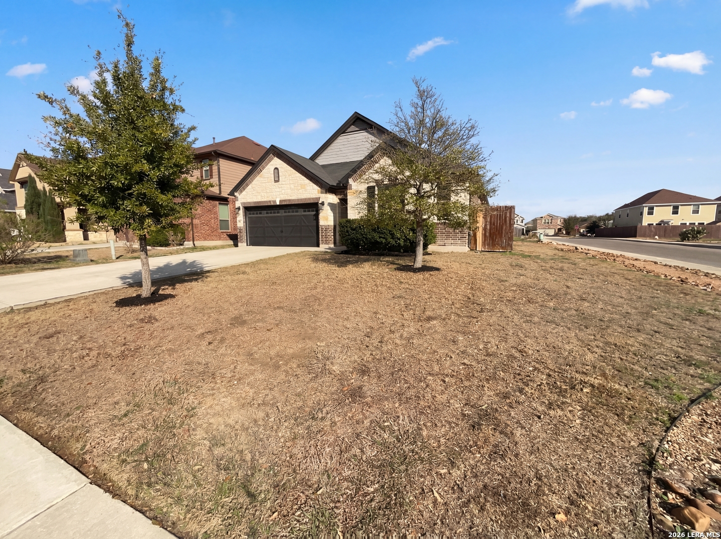 11403 Sawyer Road San Antonio, TX 78238 - Photo 6 of 20 a view of a house with a yard and a large tree