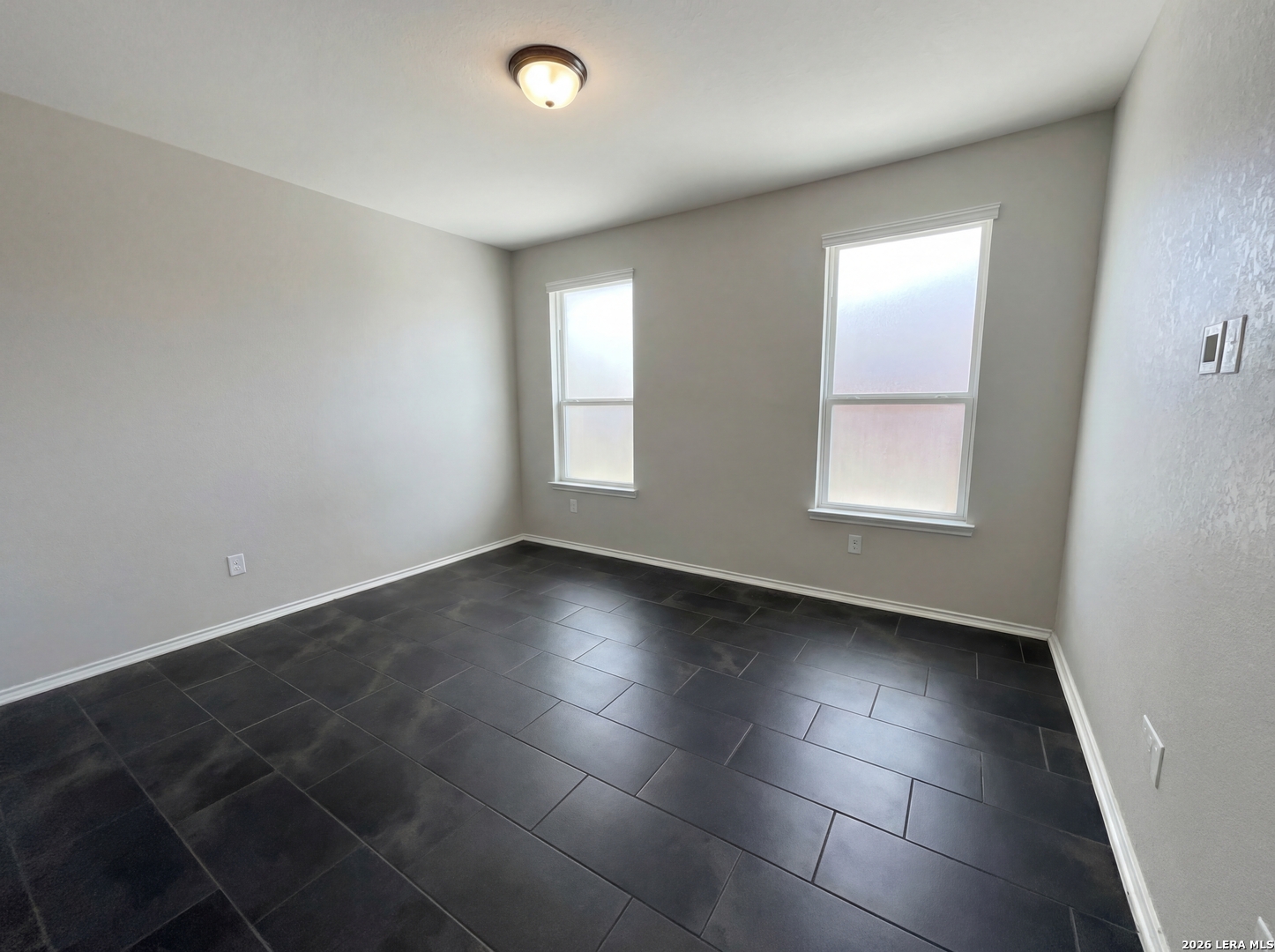 11403 Sawyer Road San Antonio, TX 78238 - Photo 9 of 20 an empty room with large windows