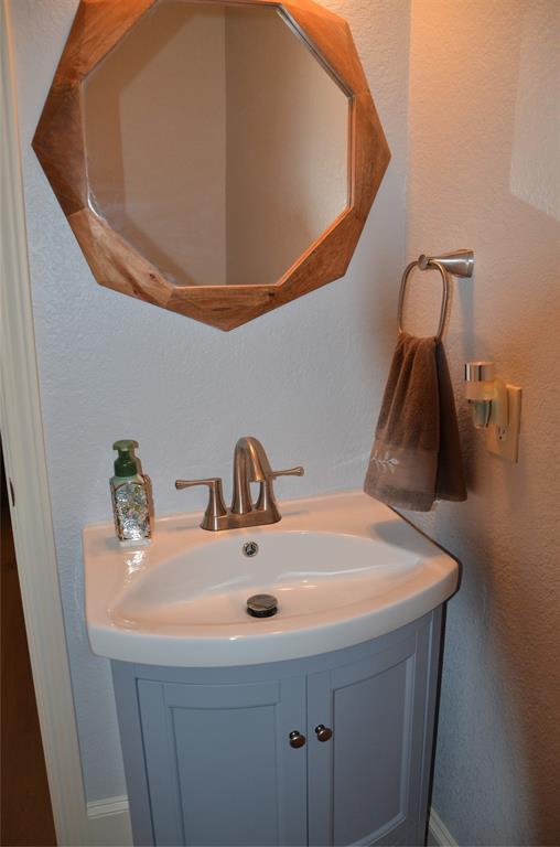 1224 Harvard Lane Allen, TX 75002 - Photo 10 of 26 Powder Room located just off the Family Room