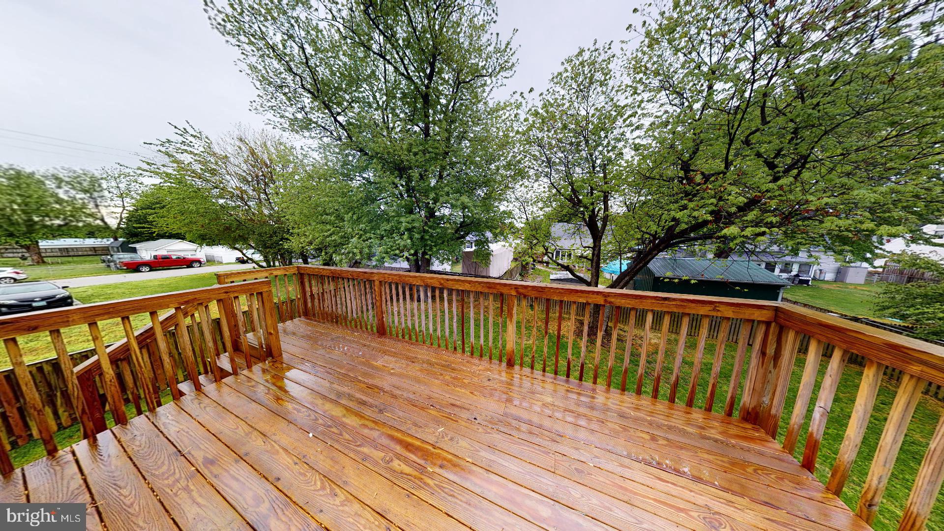 174 Carroll Road Pasadena, MD 21122 - Photo 42 of 57 12x16 top deck with landing and stairs to out bac