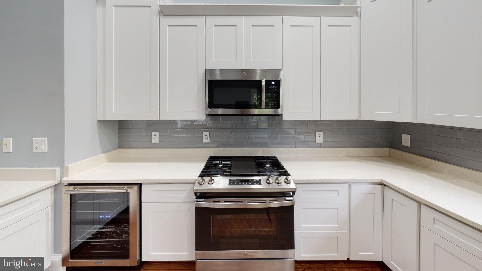 174 Carroll Road Pasadena, MD 21122 - Photo 10 of 57 wine cooler and gas range with griddle
