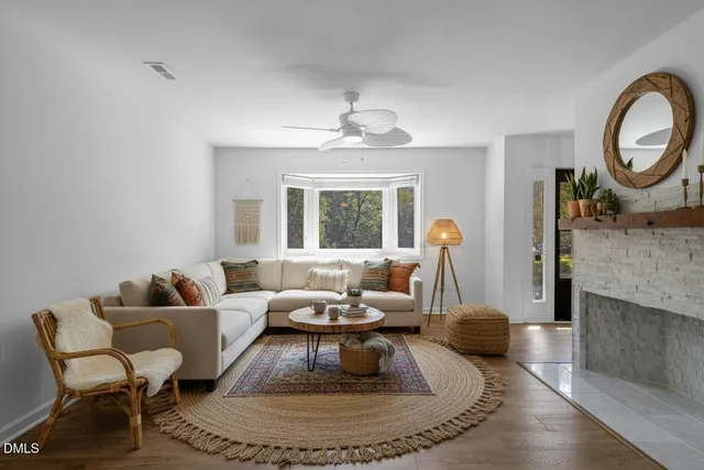 a living room with furniture and a fireplace