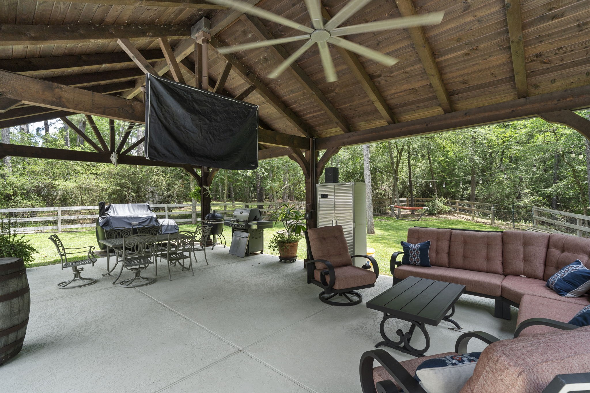 19610 Timber Ridge Drive Magnolia, TX 77355 - Photo 39 of 50 The pavilion has a remote controlled drop down TV, and there's plumbing for water, gas and even an IT line that was ran to it for your entertainment needs.