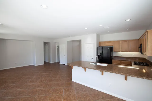 a view of kitchen with stainless steel appliances kitchen island