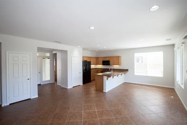 a view of kitchen with microwave and window