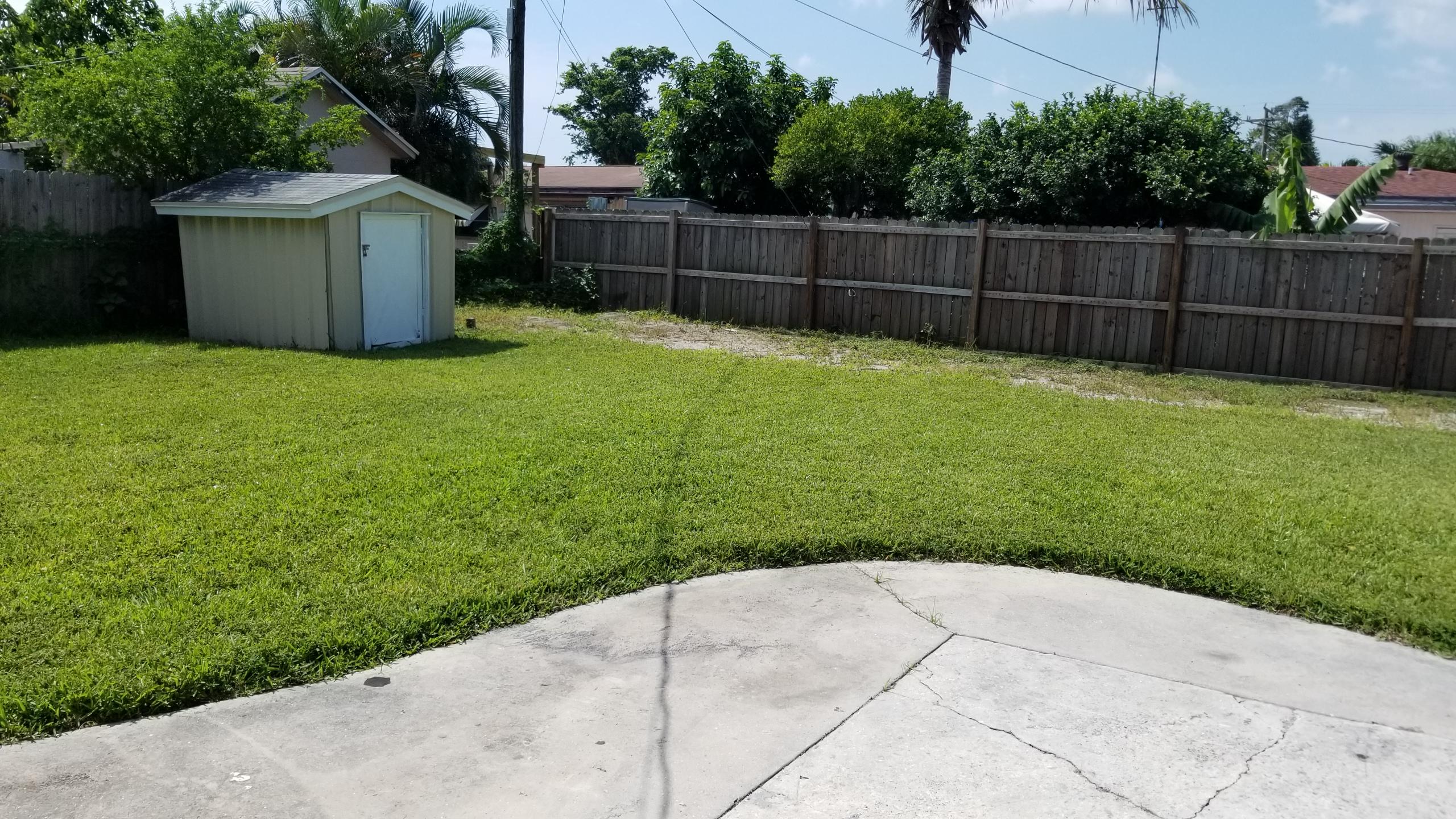 832 Cherry Road West Palm Beach, FL 33409 - Photo 12 of 16 patio space and yard