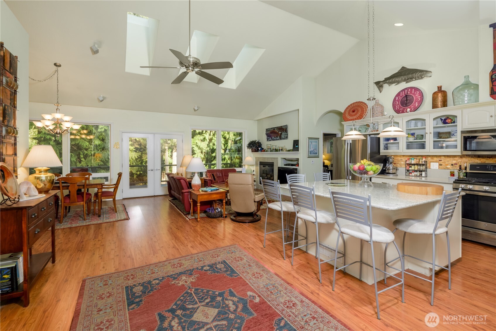 121 Buck Loop Road Sequim, WA 98382 - Photo 11 of 40 a living room with lots of furniture and kitchen view