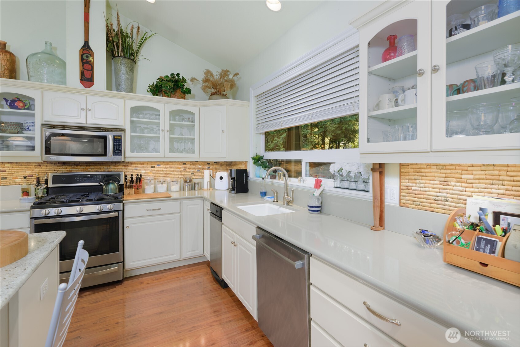 121 Buck Loop Road Sequim, WA 98382 - Photo 15 of 40 a kitchen with stainless steel appliances granite countertop a stove and a sink