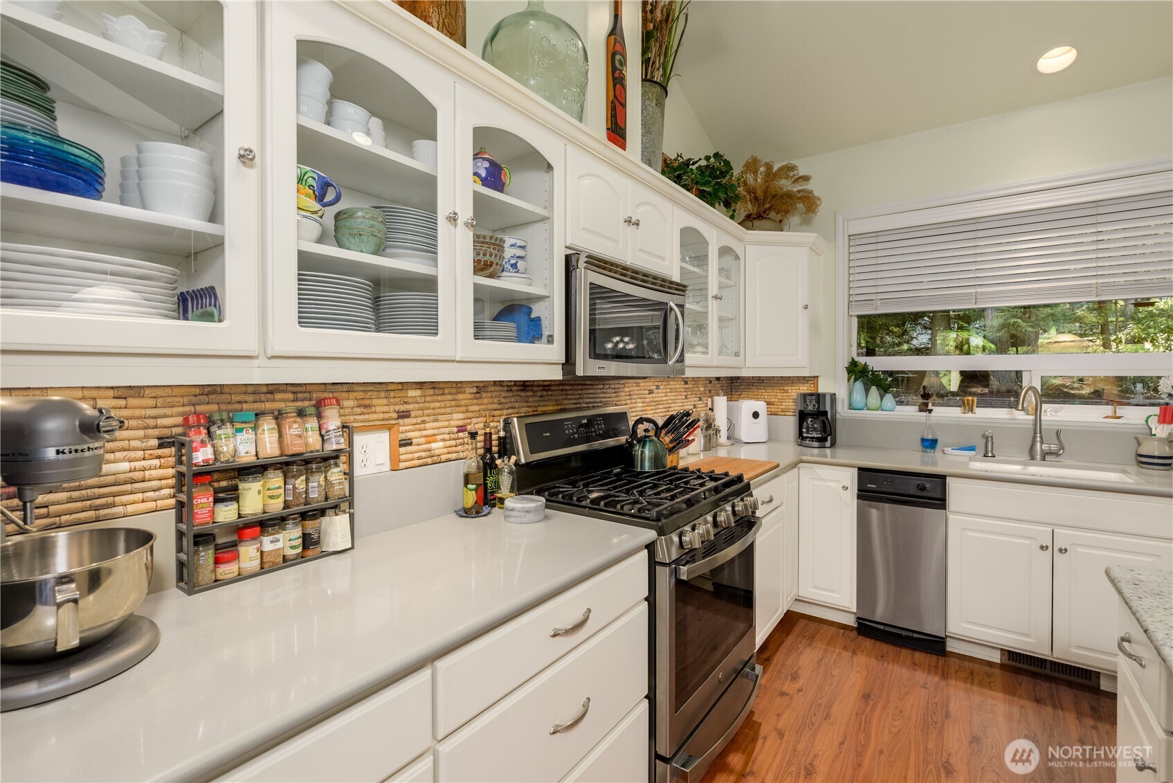 121 Buck Loop Road Sequim, WA 98382 - Photo 16 of 40 a kitchen with stainless steel appliances a stove a sink and a microwave