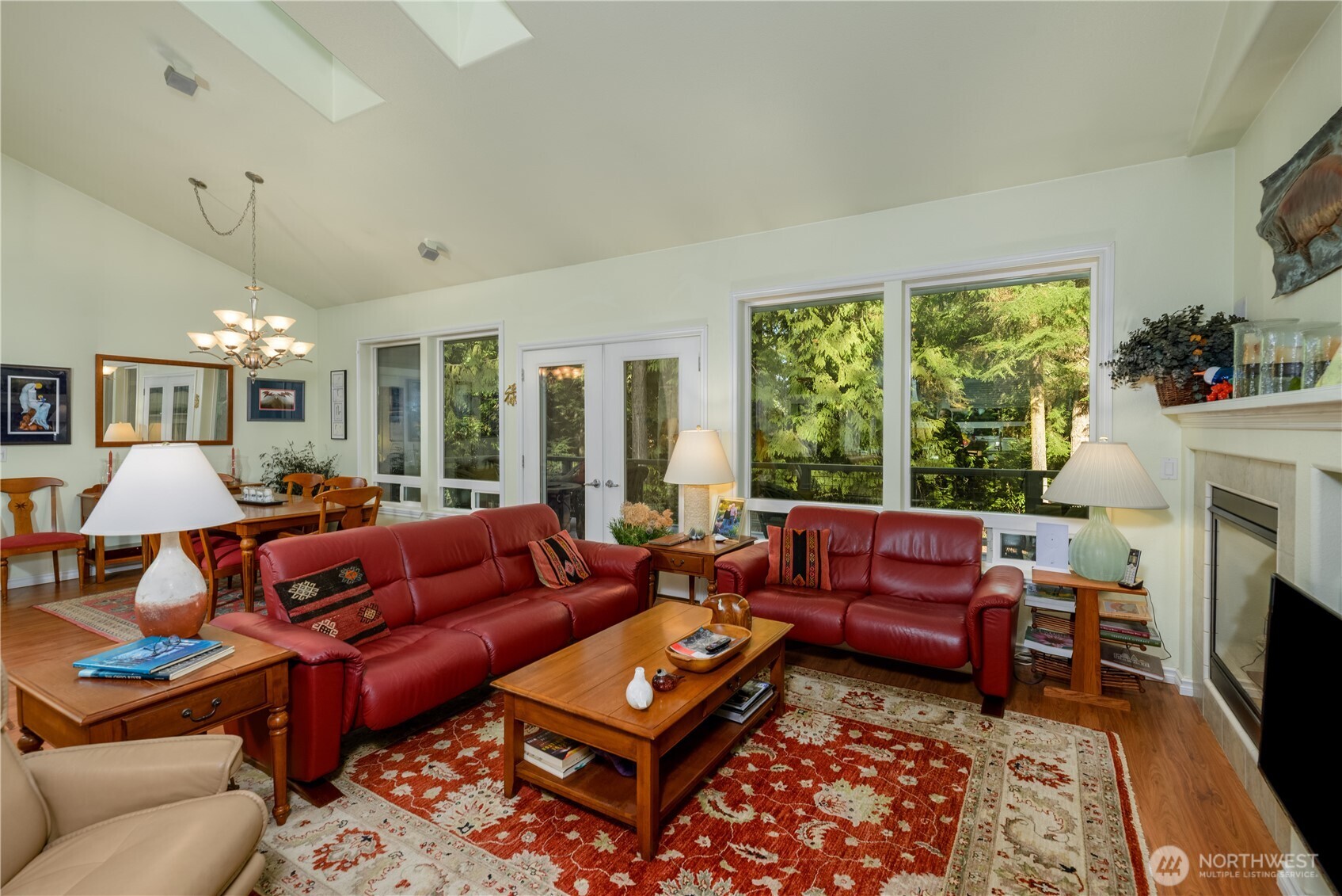 121 Buck Loop Road Sequim, WA 98382 - Photo 17 of 40 a living room with furniture fireplace and large windows