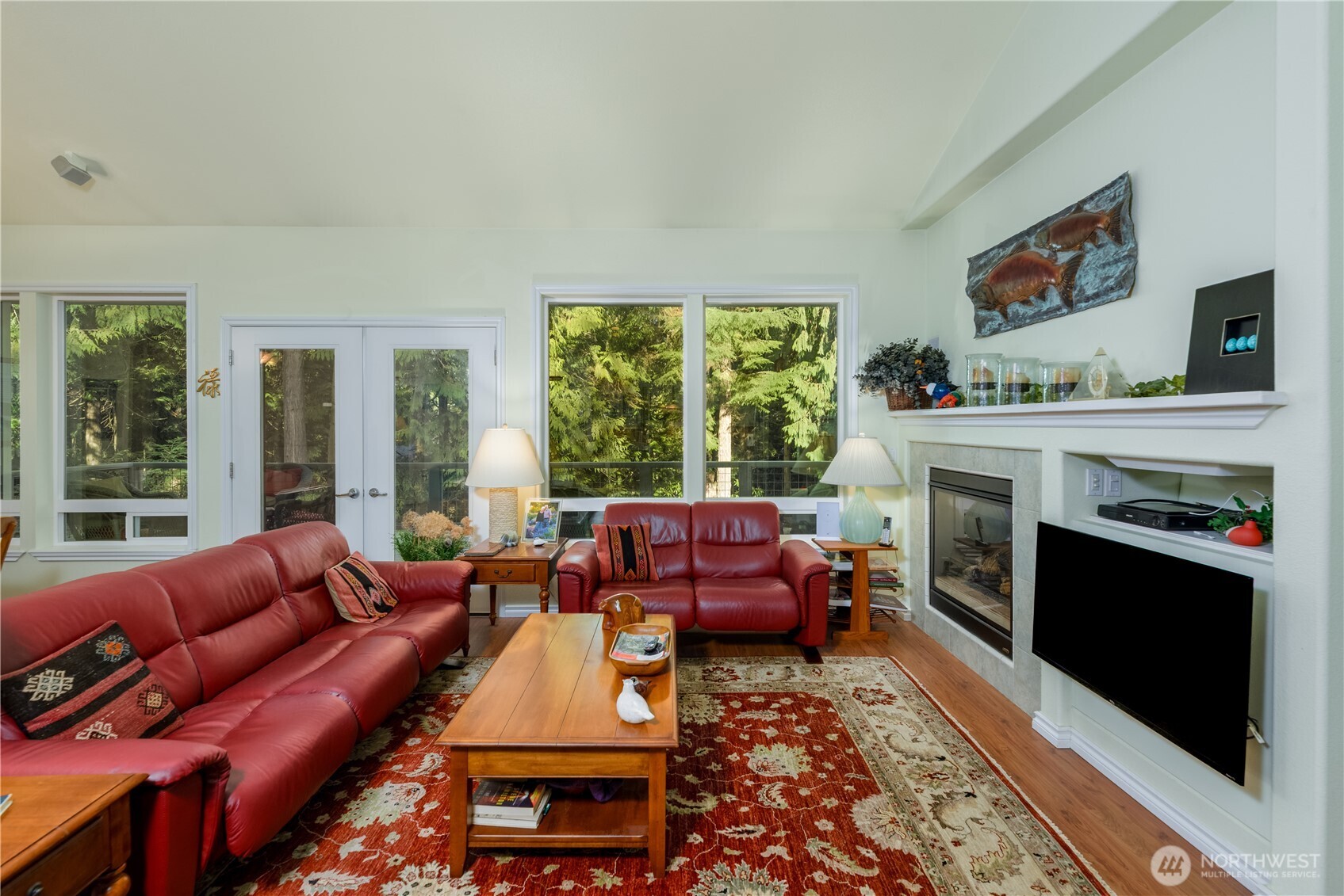 121 Buck Loop Road Sequim, WA 98382 - Photo 18 of 40 a living room with furniture and a fireplace