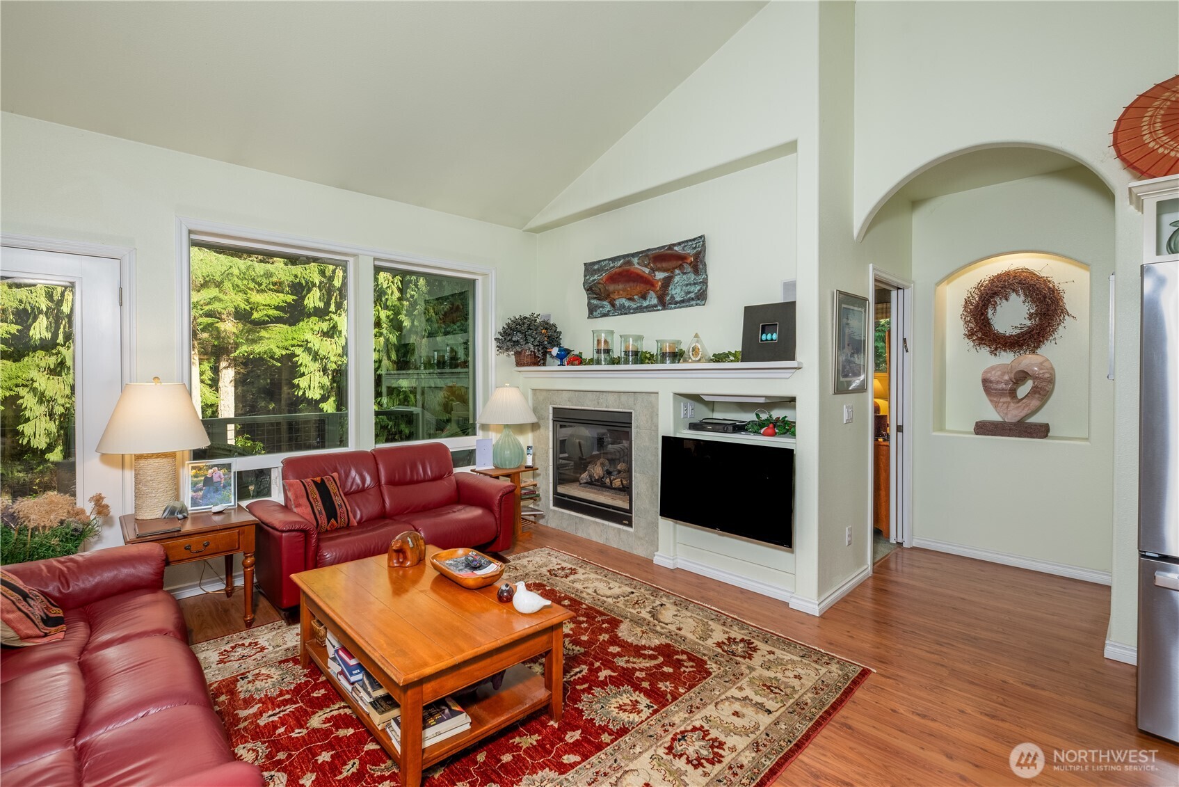 121 Buck Loop Road Sequim, WA 98382 - Photo 20 of 40 a living room with furniture and a fireplace