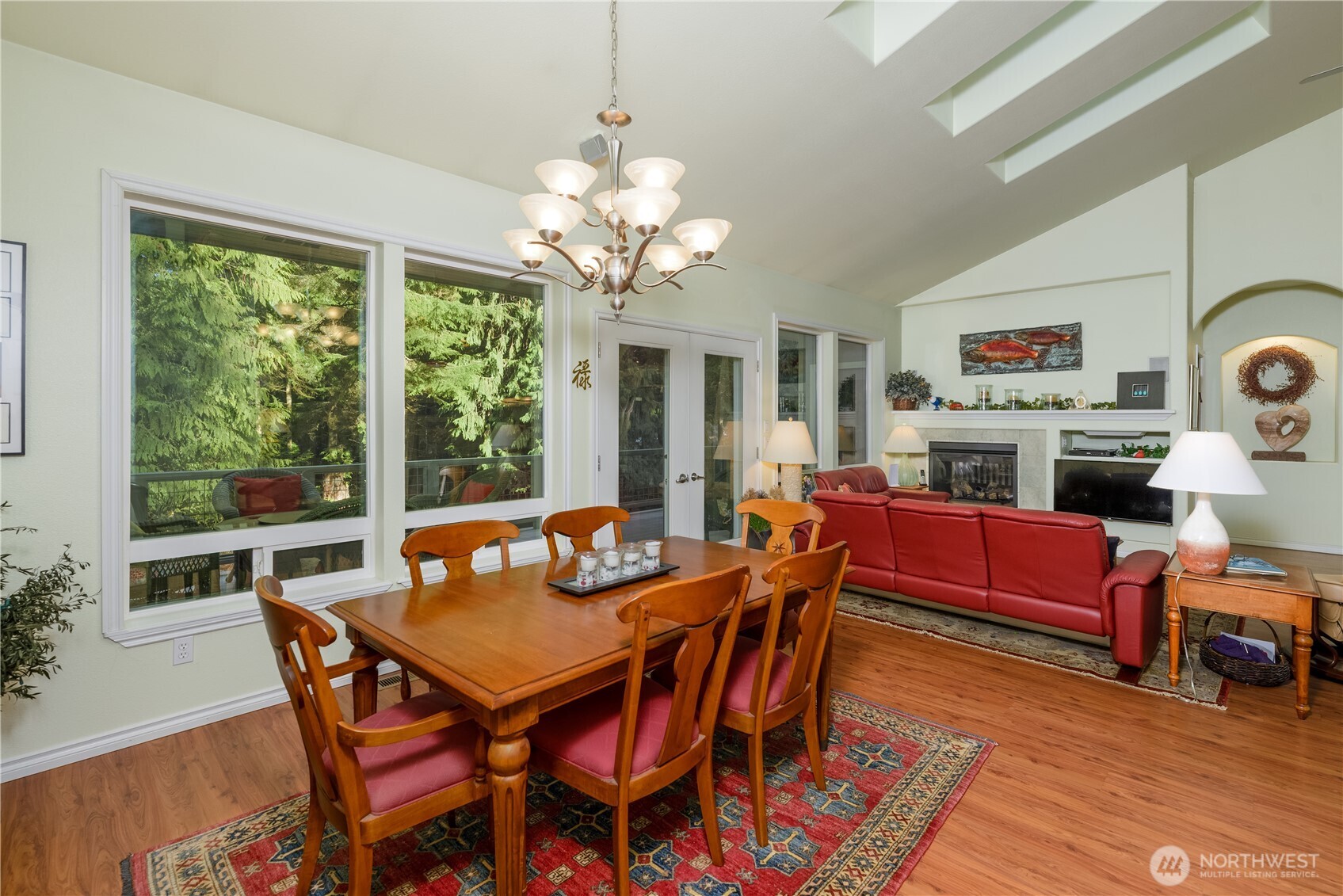 121 Buck Loop Road Sequim, WA 98382 - Photo 21 of 40 a view of a dining room with furniture window and wooden floor