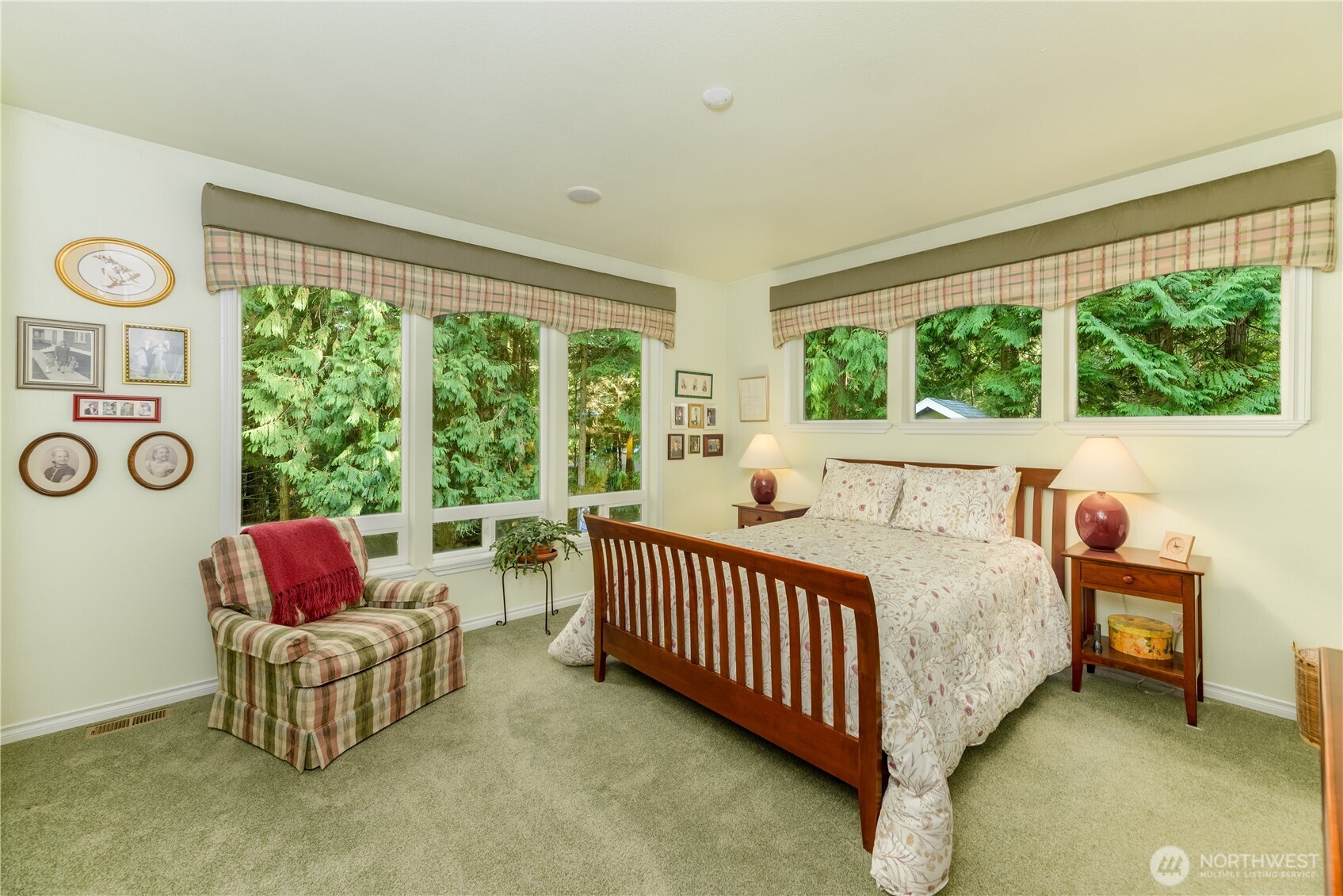 121 Buck Loop Road Sequim, WA 98382 - Photo 23 of 40 a bedroom with bed and a couch