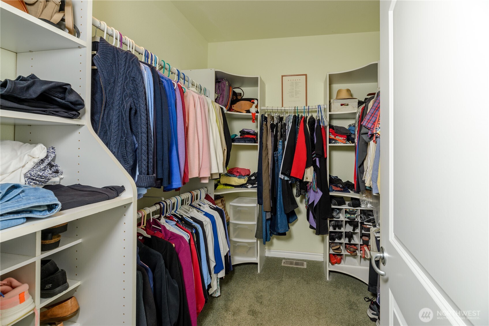 121 Buck Loop Road Sequim, WA 98382 - Photo 27 of 40 a view of walk in closet with clothes and shoes
