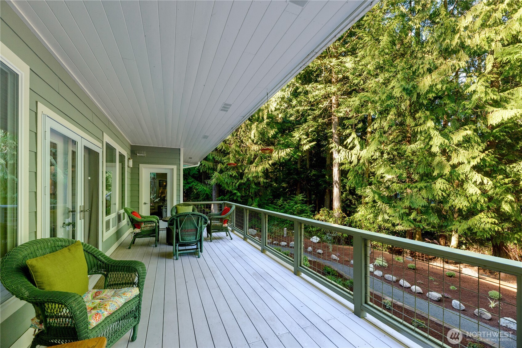 121 Buck Loop Road Sequim, WA 98382 - Photo 36 of 40 a view of a chair and tables in the balcony
