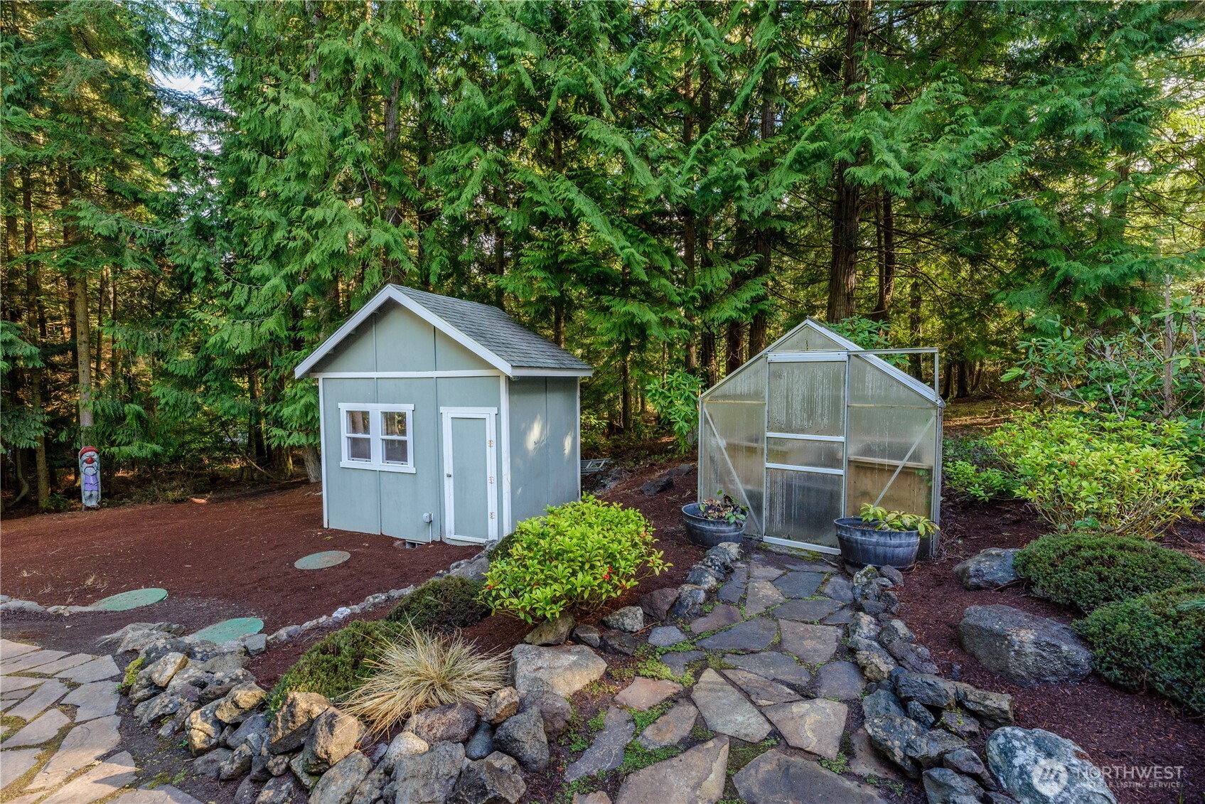 121 Buck Loop Road Sequim, WA 98382 - Photo 40 of 40 a front view of a house with garden
