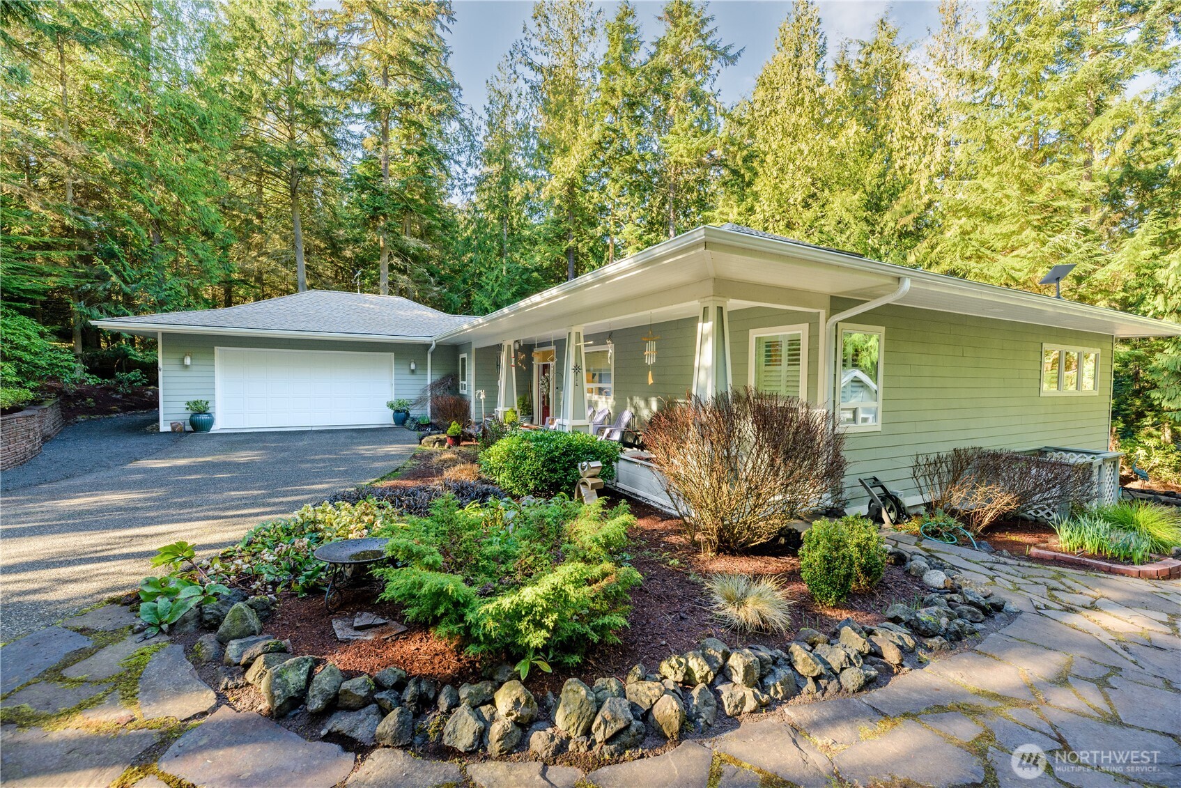 121 Buck Loop Road Sequim, WA 98382 - Photo 5 of 40 a front view of a house with a yard