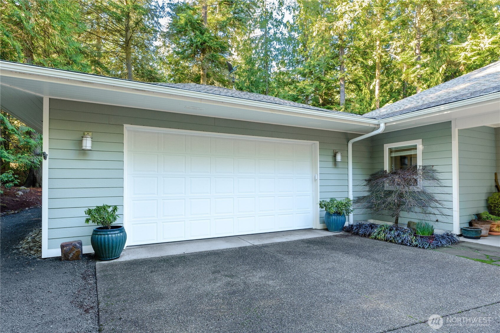 121 Buck Loop Road Sequim, WA 98382 - Photo 7 of 40 a view of a house with a garage