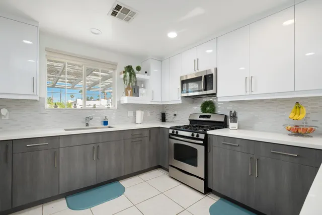 a view of storage and utility room with wooden floor