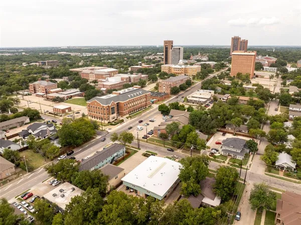 an aerial view of a city with lots of residential buildings