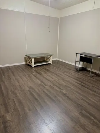 a view of work space with wooden floor