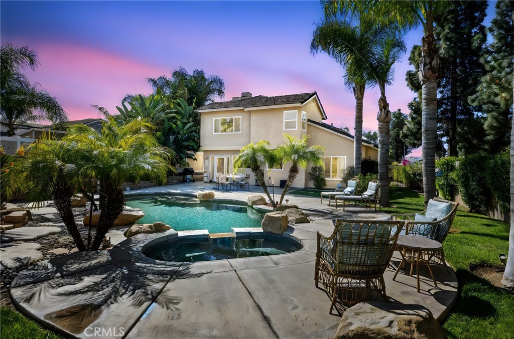 19500 Chinotto Lane Riverside, CA 92508 - Photo 1 of 1 a view of a backyard with sitting area and furniture