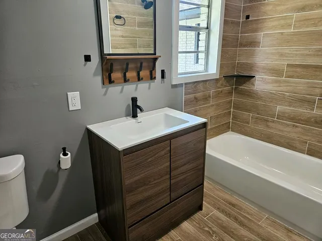 a view of kitchen island with furniture and wooden floor