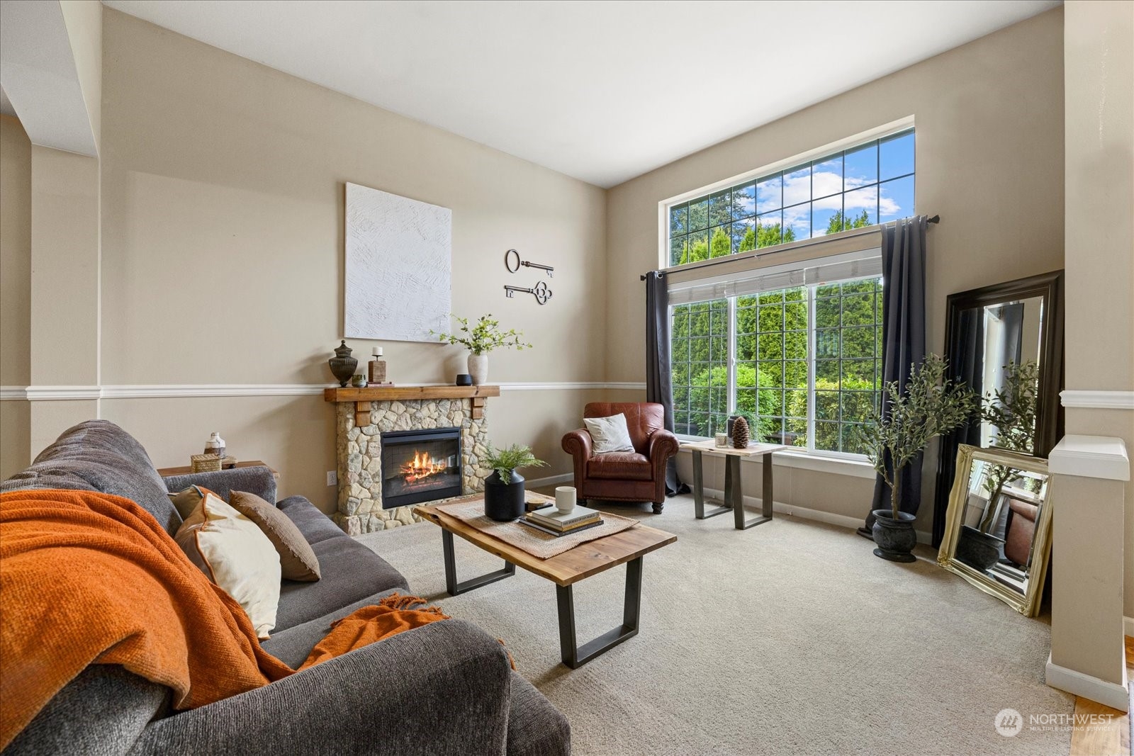428 199th Place Southeast Bothell, WA 98012 - Photo 3 of 40 a living room with furniture and a floor to ceiling window