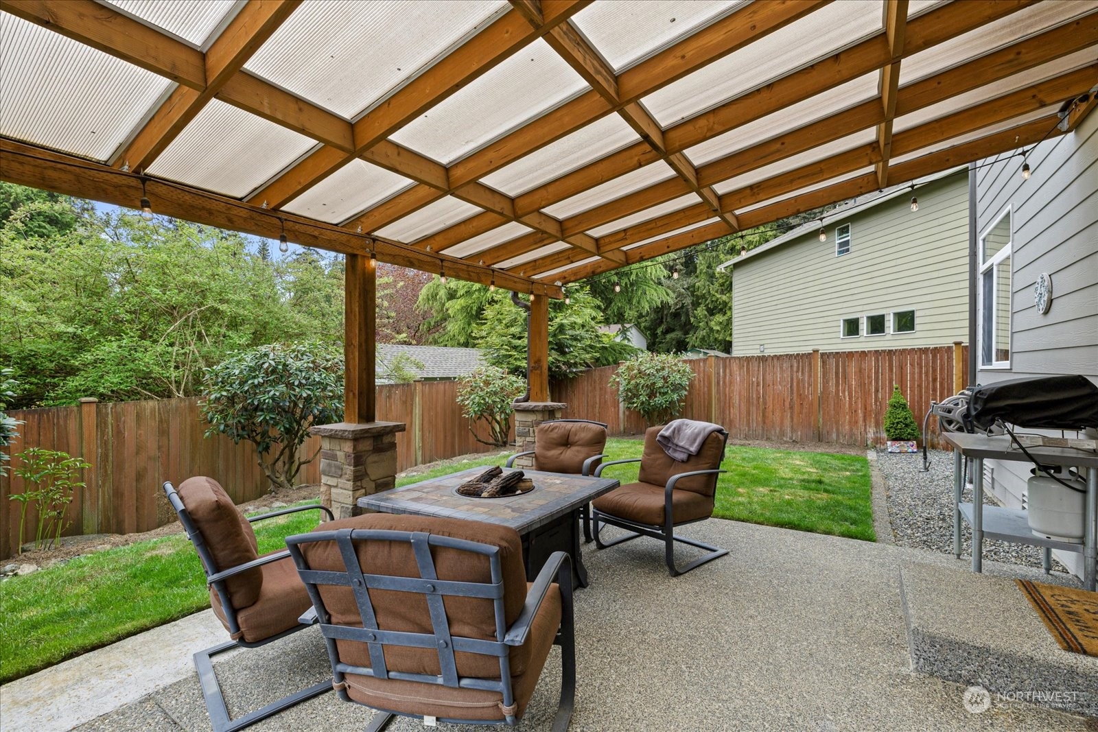 428 199th Place Southeast Bothell, WA 98012 - Photo 36 of 40 a view of a patio with a table chairs and a backyard