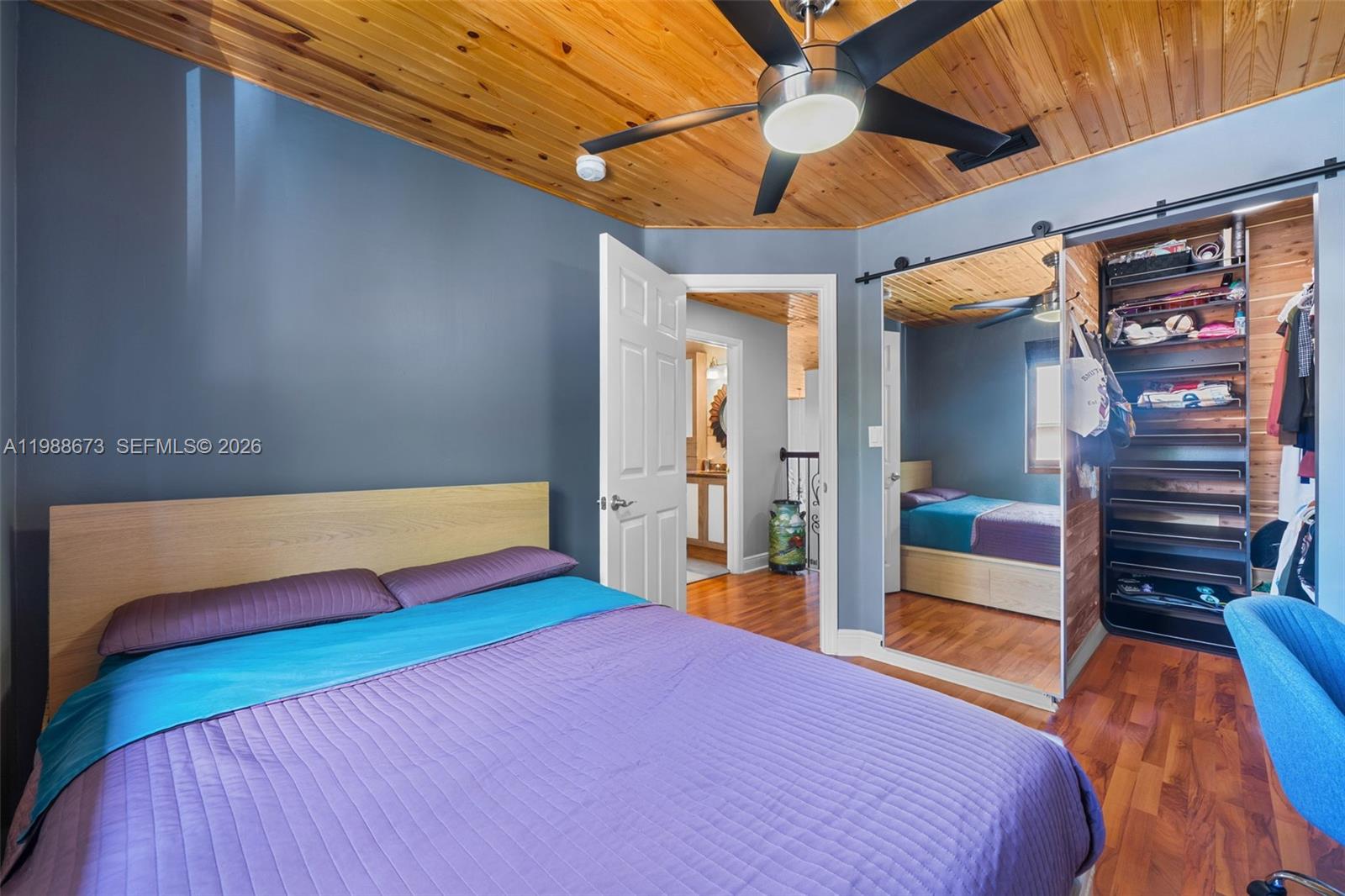 14888 Southwest 140th Street Miami, FL 33196 - Photo 17 of 76 a bedroom with a bed and a walk in closet