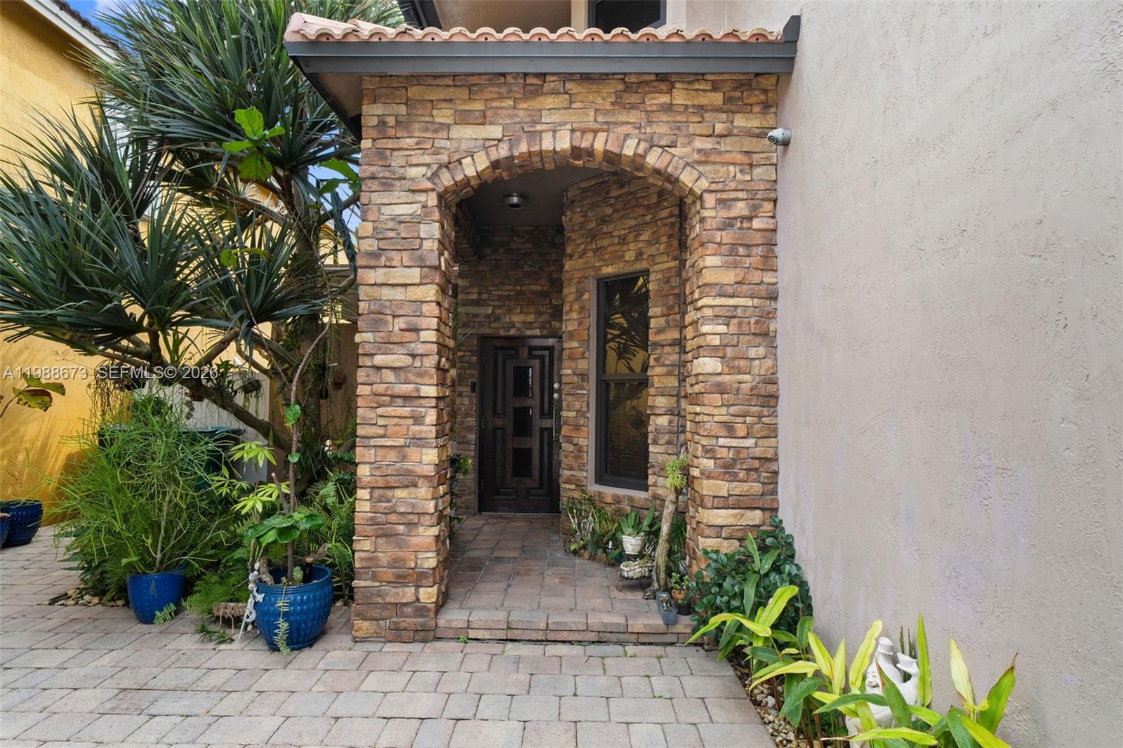 14888 Southwest 140th Street Miami, FL 33196 - Photo 2 of 76 a front view of a house with a garage