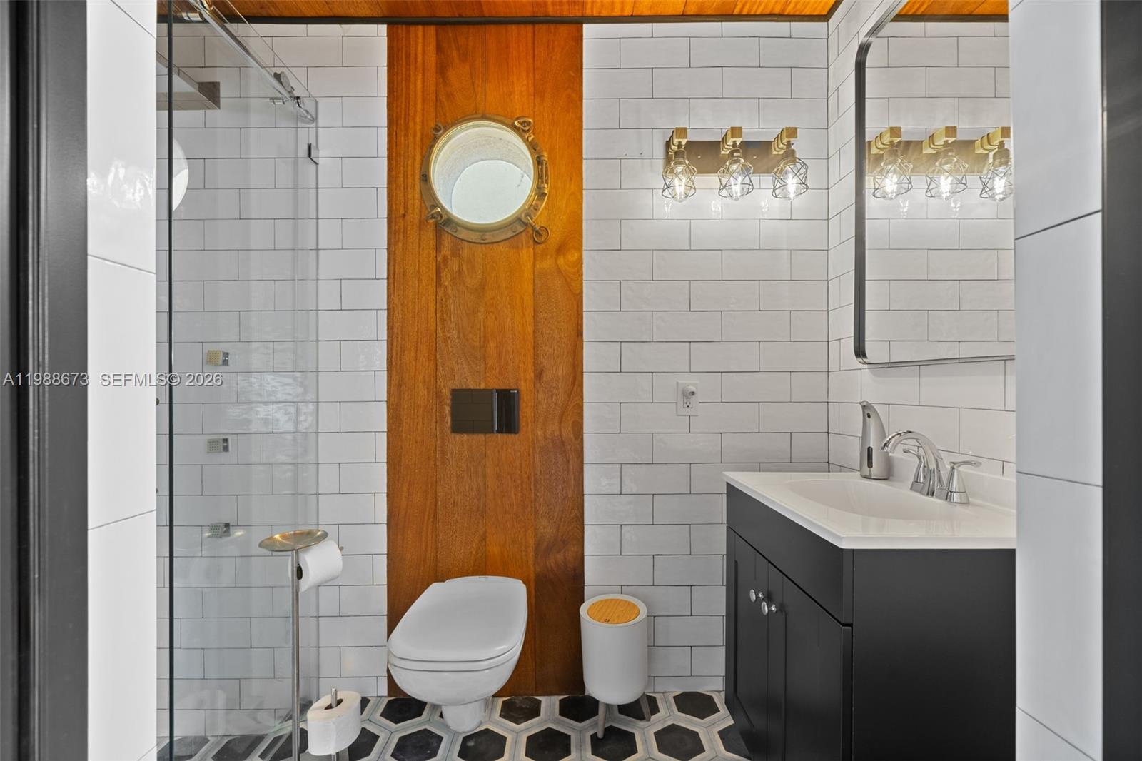 14888 Southwest 140th Street Miami, FL 33196 - Photo 26 of 76 a bathroom with a sink toilet and shower
