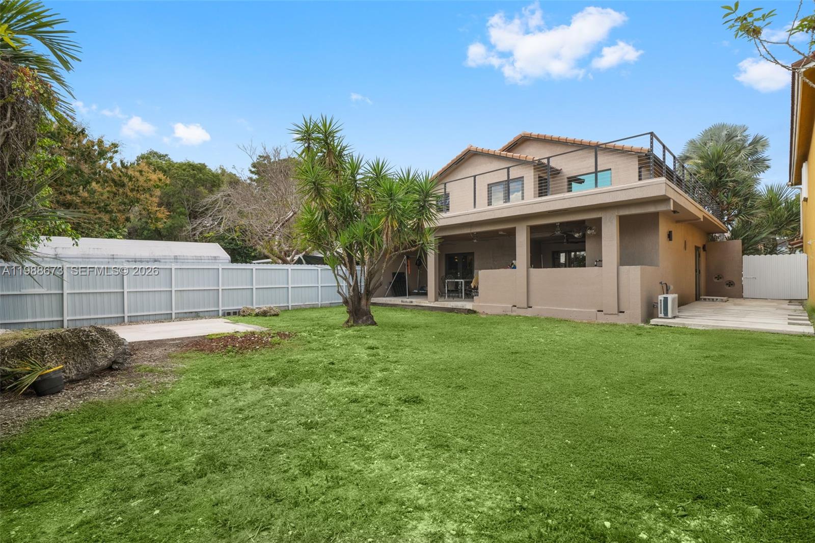 14888 Southwest 140th Street Miami, FL 33196 - Photo 34 of 76 a view of a house with a backyard