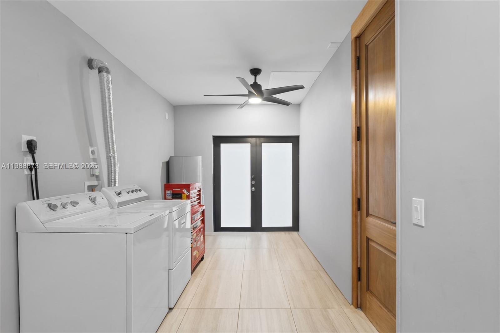 14888 Southwest 140th Street Miami, FL 33196 - Photo 41 of 76 a view of hallway with washer and dryer