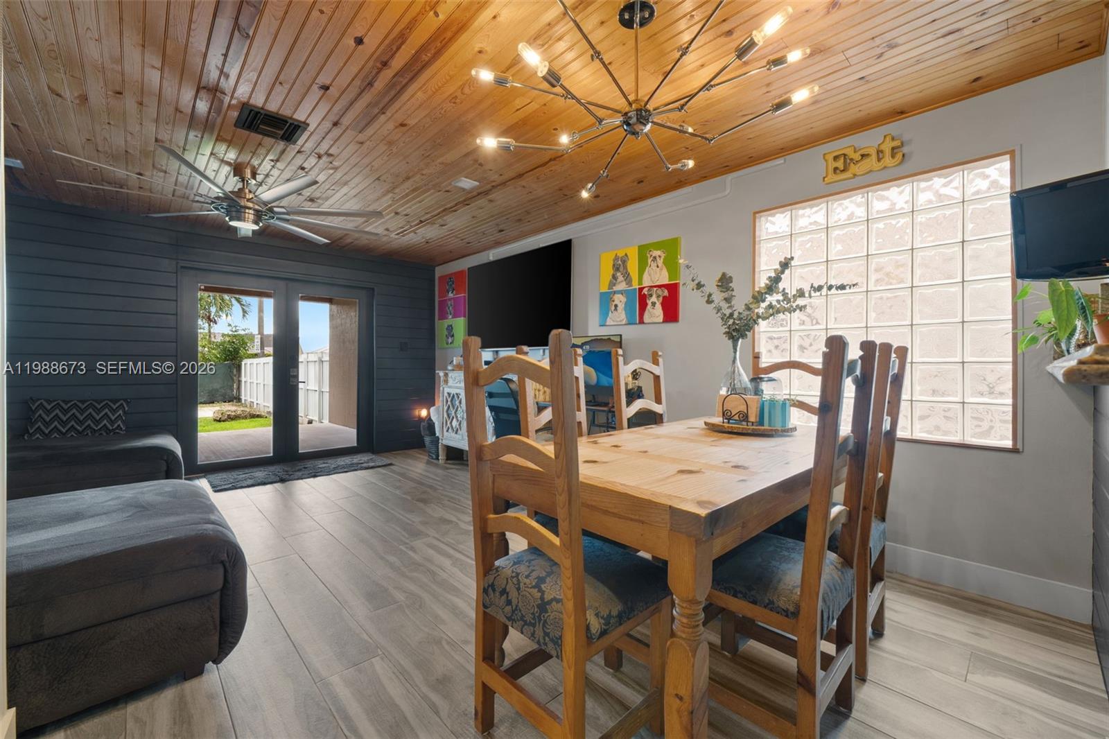 14888 Southwest 140th Street Miami, FL 33196 - Photo 46 of 76 a view of a dining room with furniture window and wooden floor